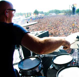 image of drummer in front of large crowd